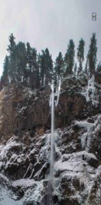 Wide angle photomerge of Multnomah Falls in the snowy, icy winter