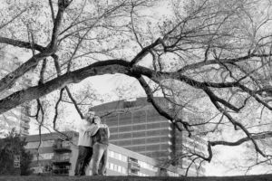 Dave and Bethany Strieff standing on a hill in Kansas City black and white